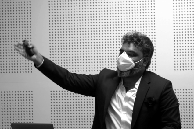 Mohit Raj pointing during a lecture