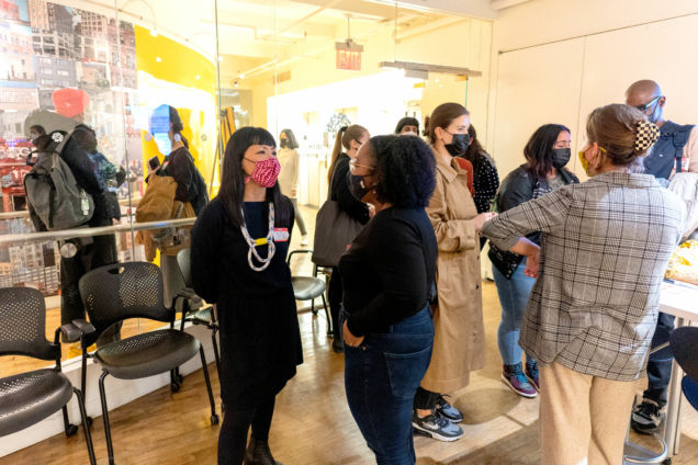 A group of people talking in the DSI studio for Open House.