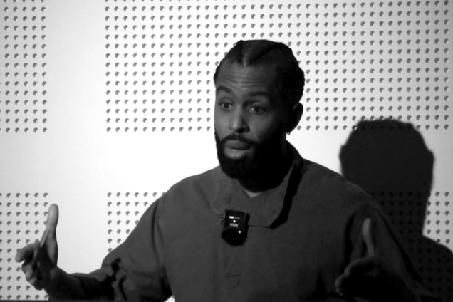 B&W image of Henry Obispo ReBORN farms speaking and gesturing