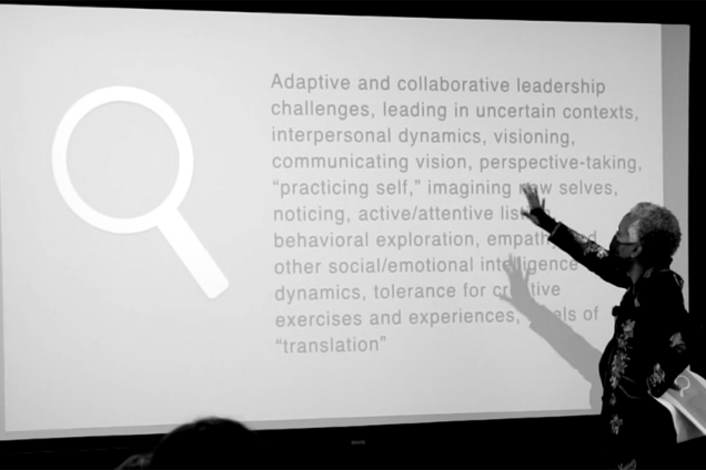 B&W image of Karen Proctor in front a screen describing Adaptive Leadership