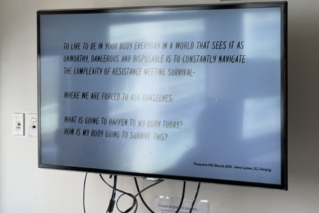 An image of a television screen with a slide from a presentation on it.