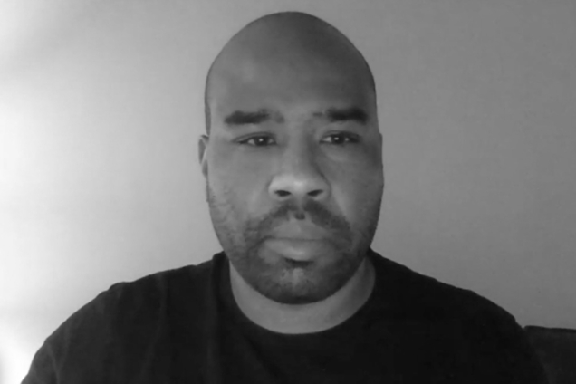 A black man on a Zoom call.