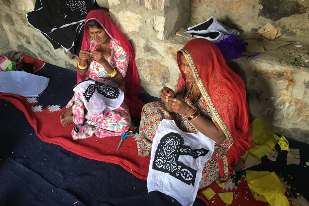 Two South Asian women engaging in Typecraft.