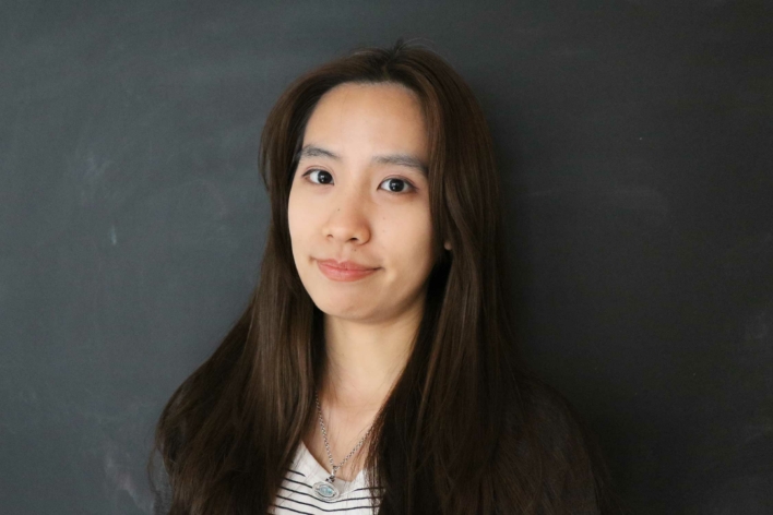 DSI student with long black hair and a black jacket.